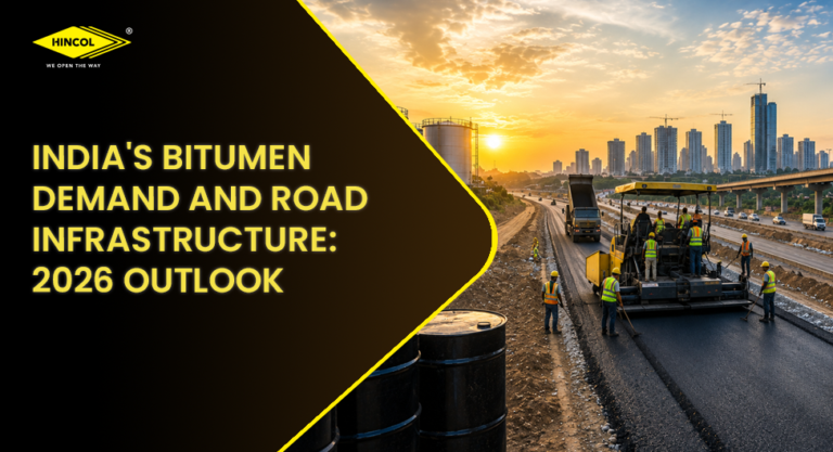 Large-scale highway construction project in India with paving equipment, workers, and bitumen storage facilities at sunrise.
